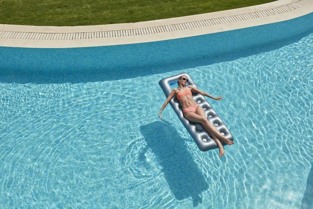 Elissa Adults-Only Lifestyle Beach Resort Kallithea  Ngoại thất bức ảnh A woman on a pool float
